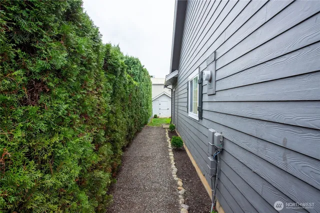 a view of house with backyard and garden