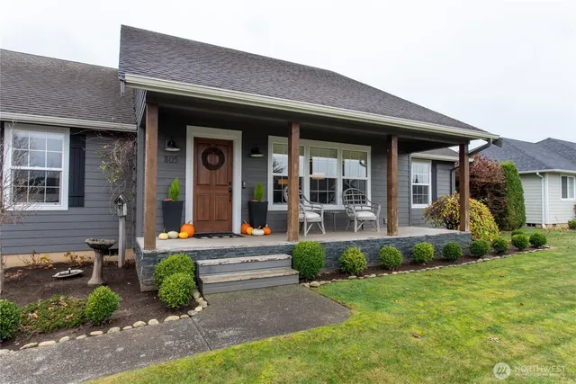a front view of a house with garden