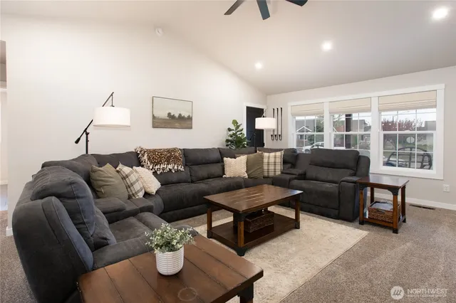 a living room with furniture and a window