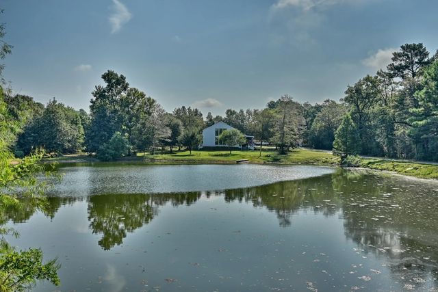 a view of a lake with trees by side of it