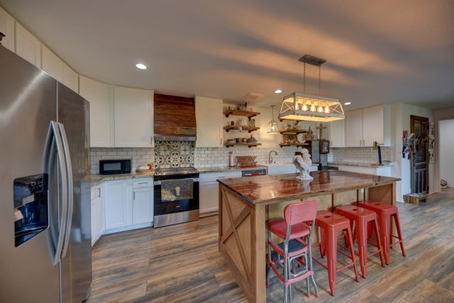 a room with a table and windows