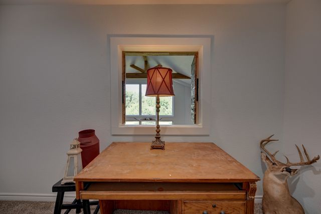 a view of balcony with wooden floor and outdoor seating