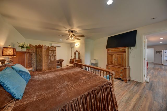 a view of an empty room and wooden floor