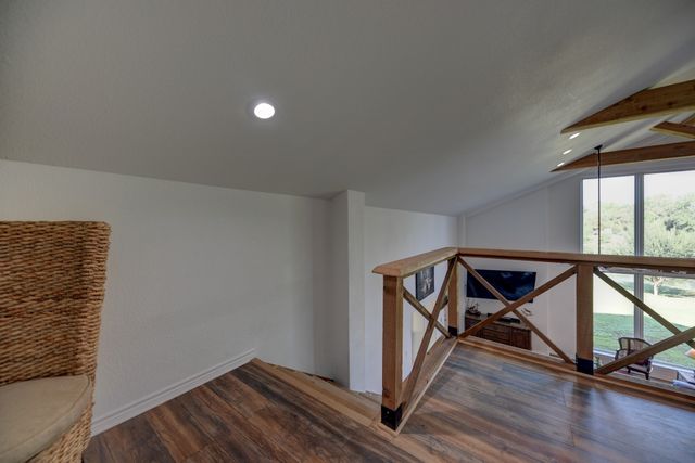 a bathroom with a toilet and a mirror