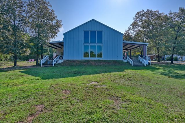 a view of front of a yard with table and chairs