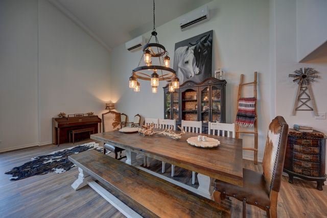 a kitchen with kitchen island granite countertop a sink cabinets and stainless steel appliances