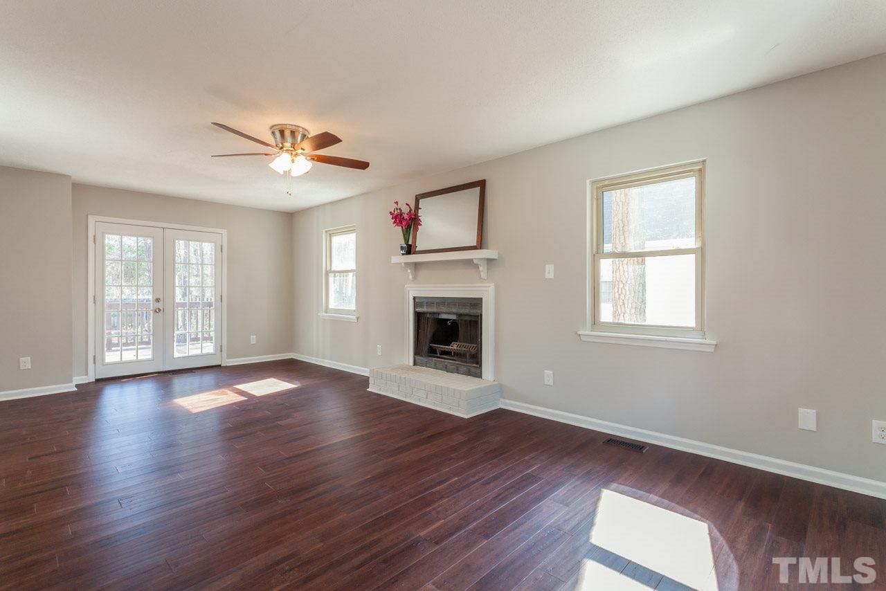 834 Horton Road Durham, NC 27704 - Photo 11 of 22 a view of an empty room with wooden floor and a window