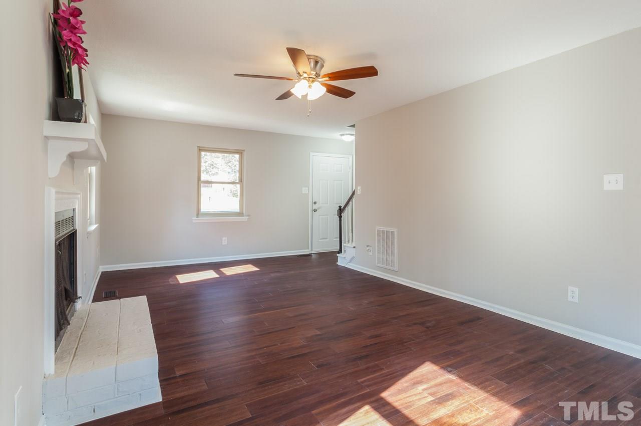 834 Horton Road Durham, NC 27704 - Photo 13 of 22 a view of an empty room with wooden floor and a window