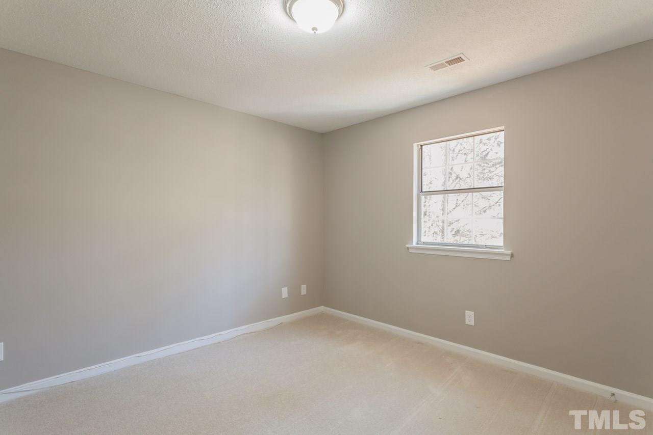 834 Horton Road Durham, NC 27704 - Photo 16 of 22 an empty room with a window