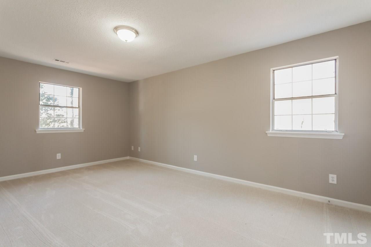 834 Horton Road Durham, NC 27704 - Photo 5 of 22 an empty room with windows