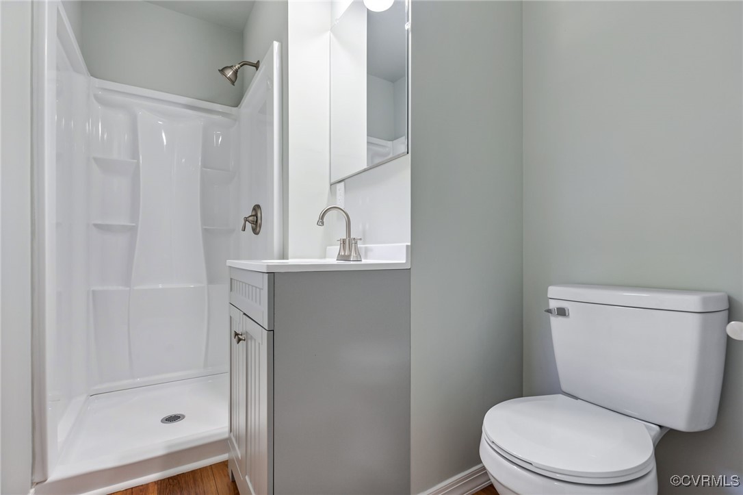 8600 Hickory Road Petersburg, VA 23803 - Photo 22 of 28 Bathroom featuring vanity, toilet, hardwood / wood