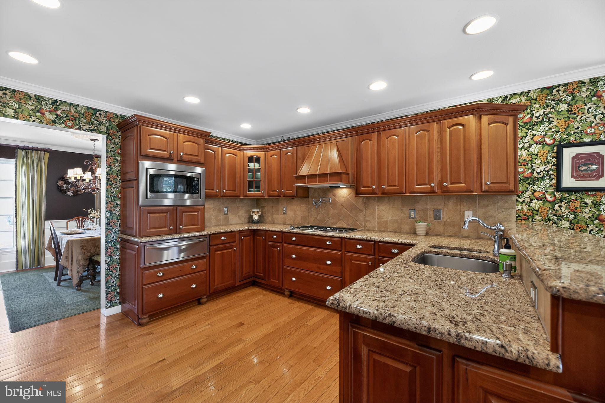 42 Callison Lane Voorhees, NJ 08043 - Photo 12 of 55 a kitchen with granite countertop a sink and cabinets
