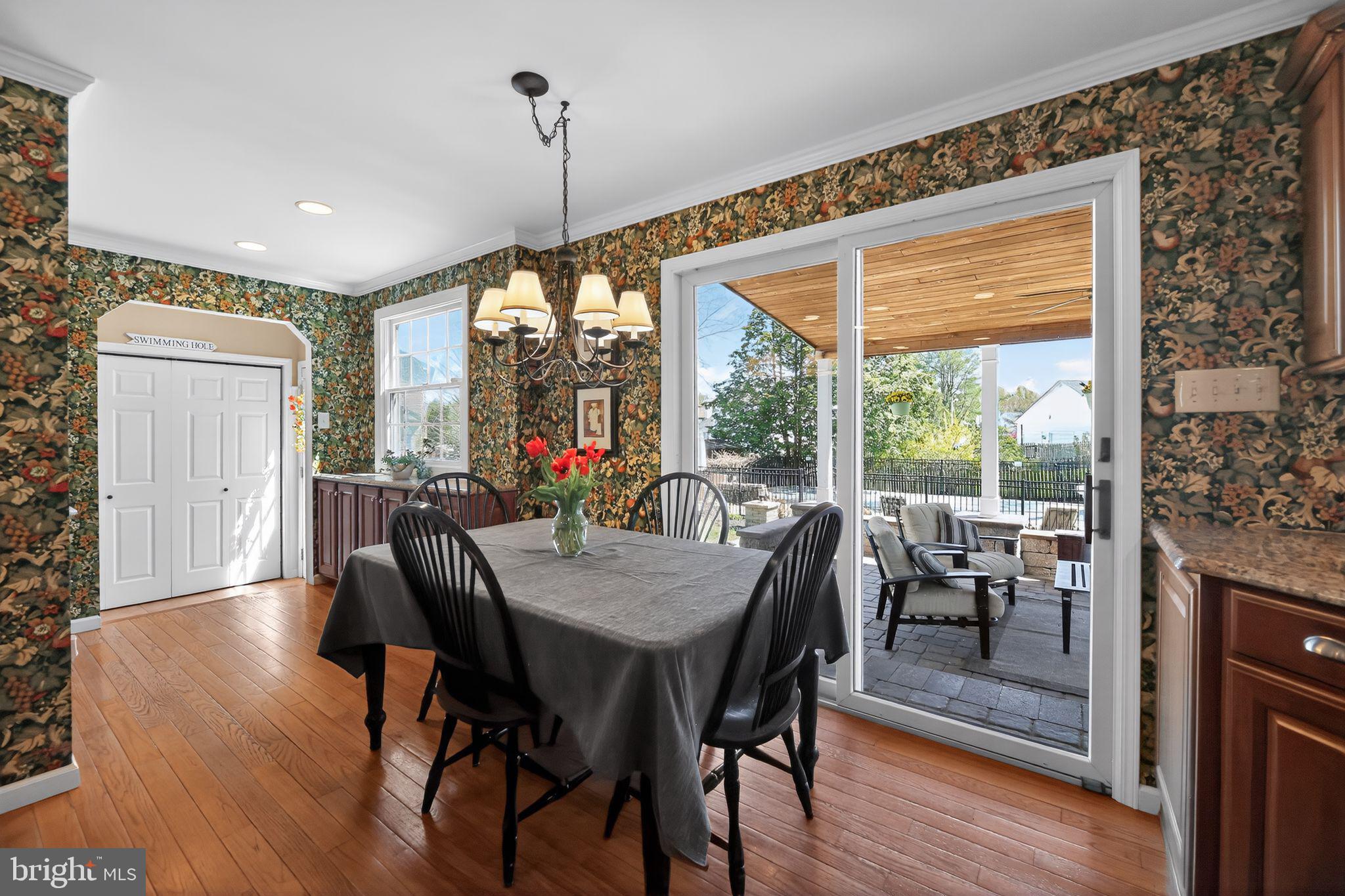 42 Callison Lane Voorhees, NJ 08043 - Photo 14 of 55 a view of a dining room with furniture window and wooden floor