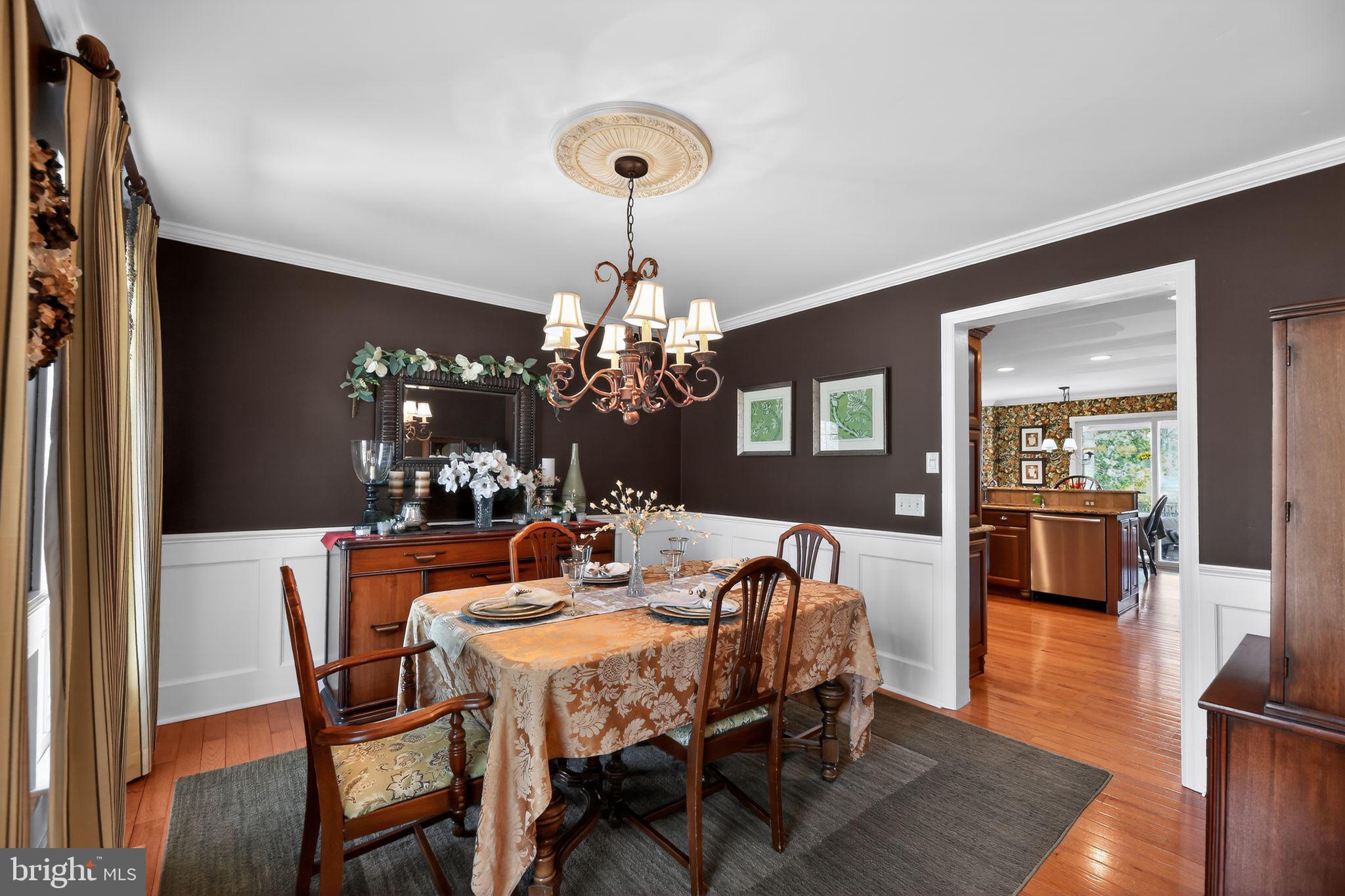 42 Callison Lane Voorhees, NJ 08043 - Photo 15 of 55 a view of a dining room with furniture and chandelier