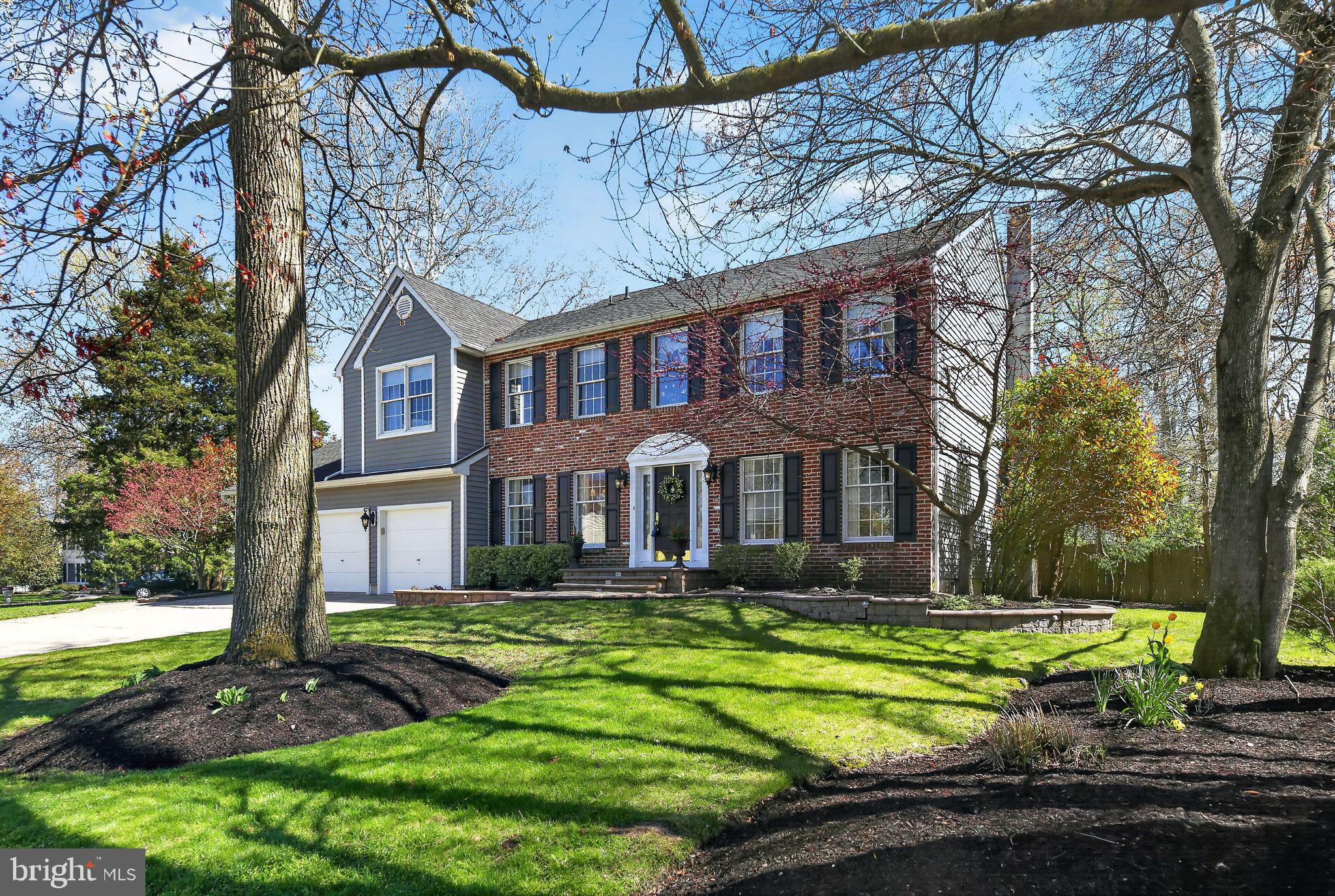 42 Callison Lane Voorhees, NJ 08043 - Photo 2 of 55 a front view of a house with a yard table and chairs