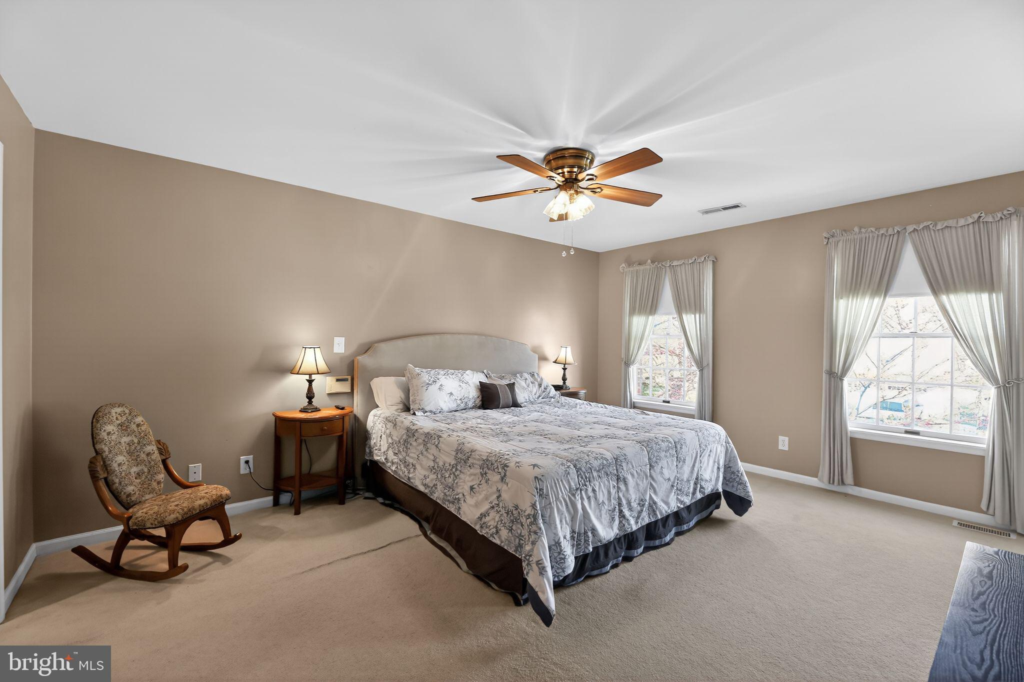 42 Callison Lane Voorhees, NJ 08043 - Photo 22 of 55 a bedroom with a bed gym equipment and a large window