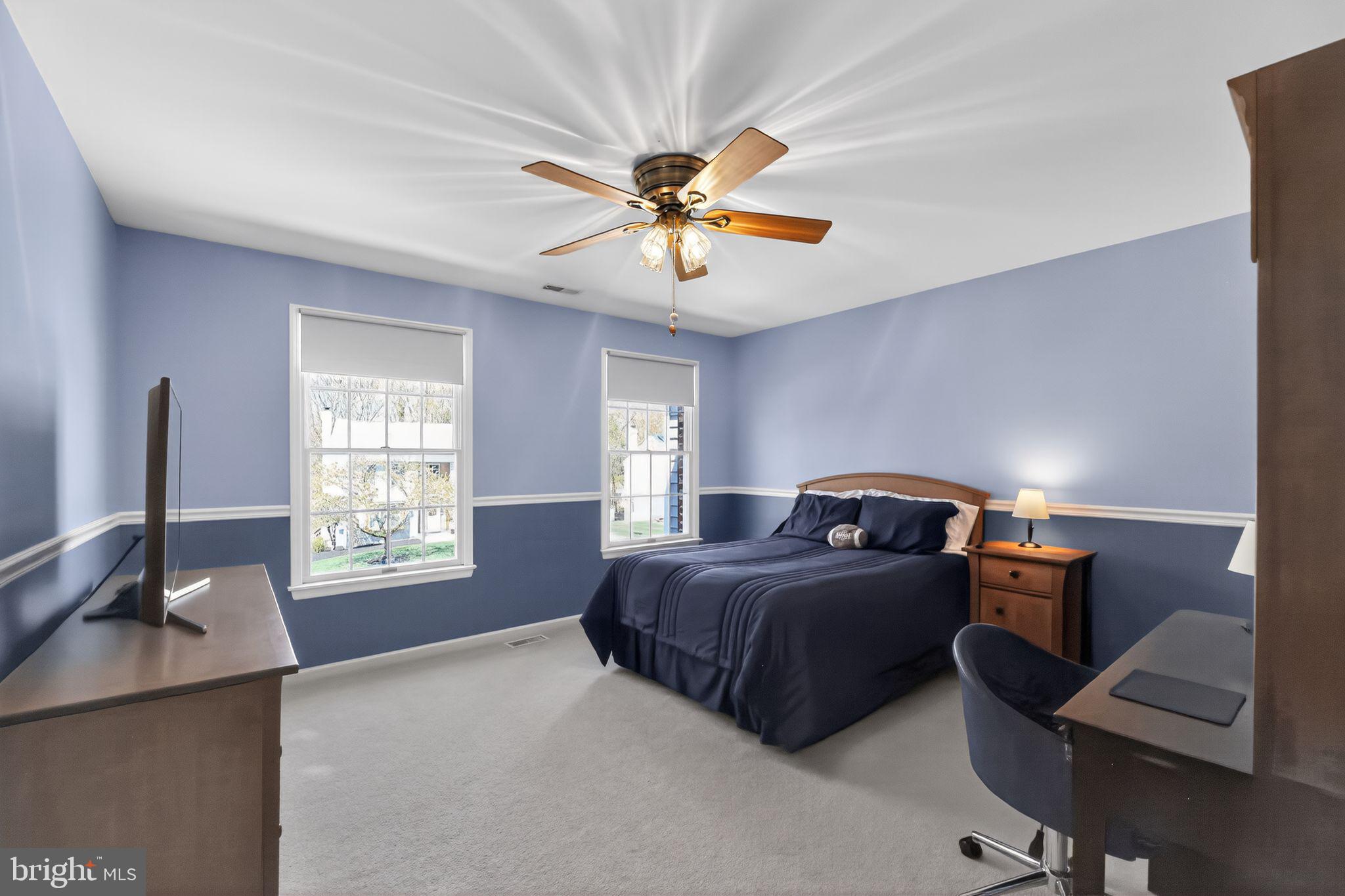42 Callison Lane Voorhees, NJ 08043 - Photo 28 of 55 a bedroom with a bed and a chandelier