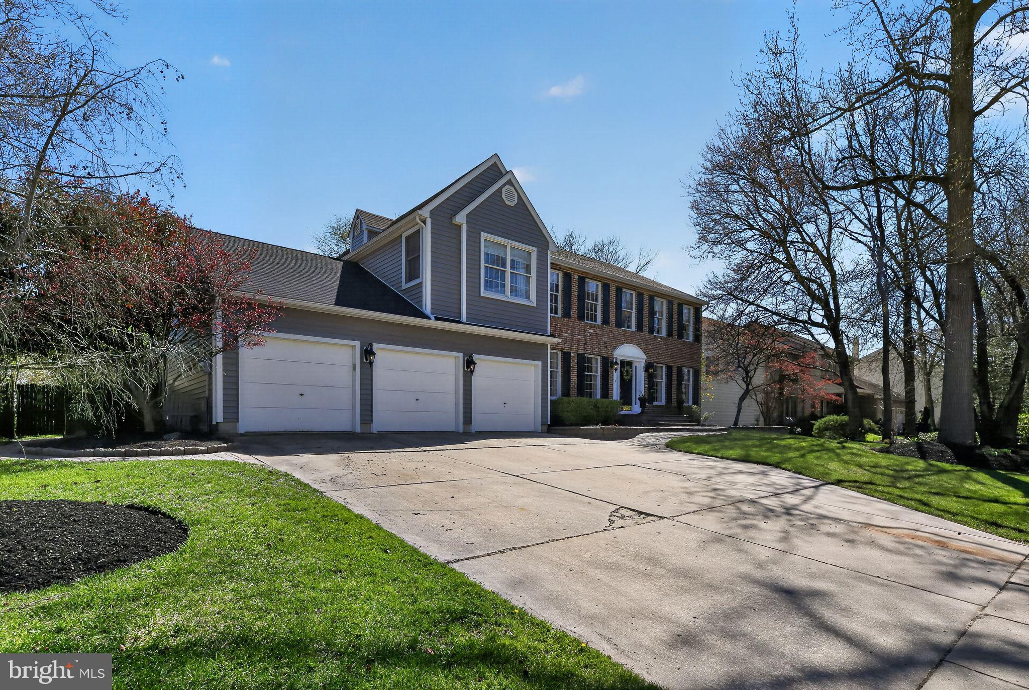 42 Callison Lane Voorhees, NJ 08043 - Photo 3 of 55 a front view of a house with a yard and garage