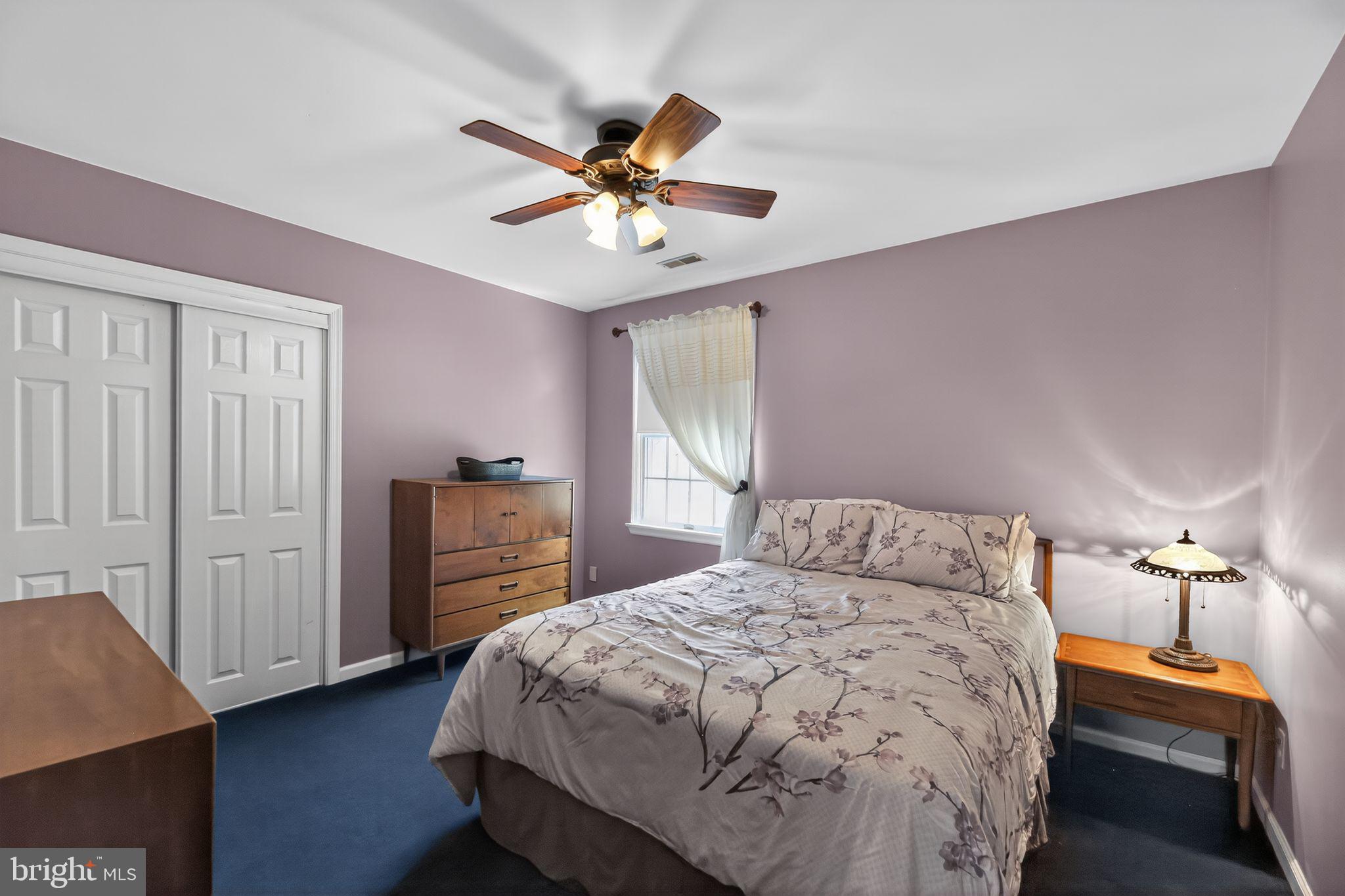 42 Callison Lane Voorhees, NJ 08043 - Photo 33 of 55 a bedroom with a bed and a chandelier