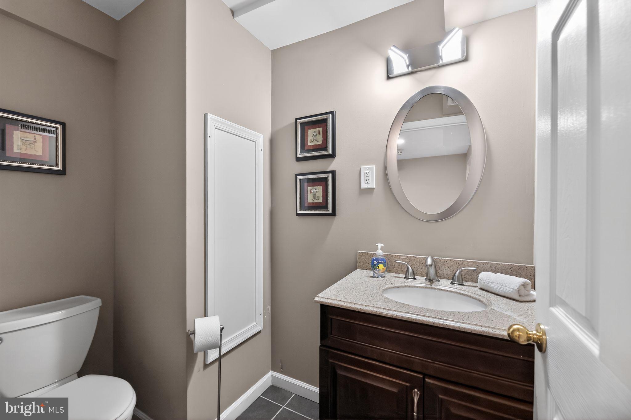 42 Callison Lane Voorhees, NJ 08043 - Photo 37 of 55 a bathroom with a sink toilet and a mirror