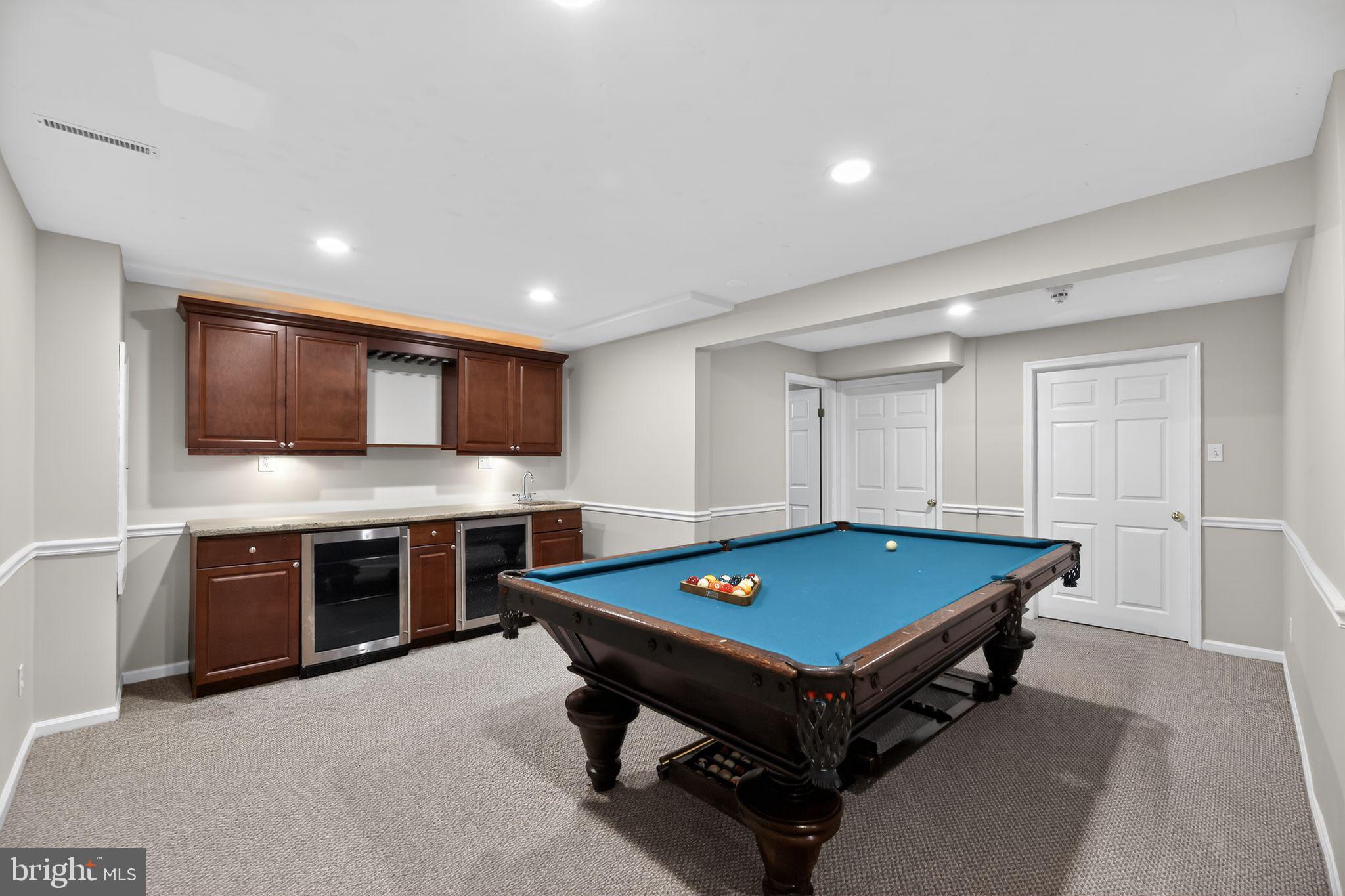 42 Callison Lane Voorhees, NJ 08043 - Photo 39 of 55 a room with pool table a flat screen tv and kitchen view