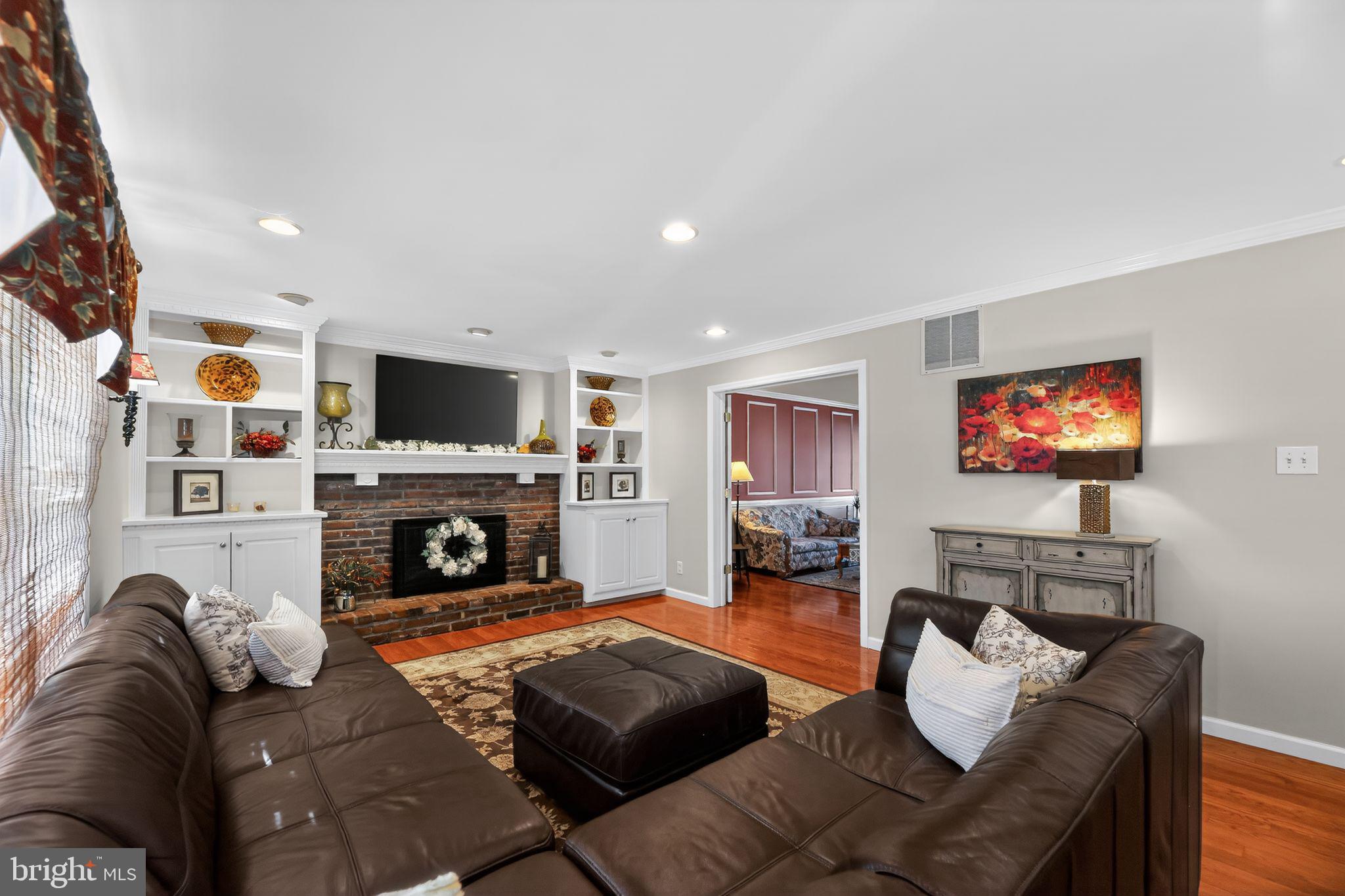 42 Callison Lane Voorhees, NJ 08043 - Photo 8 of 55 a living room with fireplace furniture and a flat screen tv