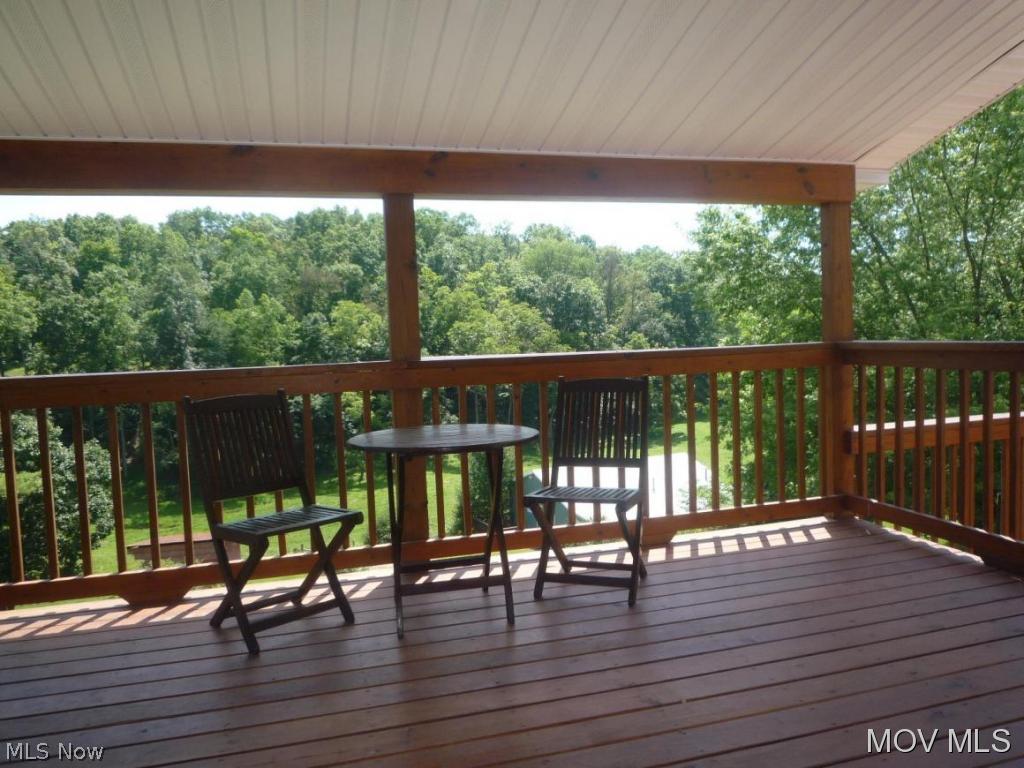 315 New England Ridge Road Washington, WV 26181 - Photo 9 of 24 Covered deck w/ wooded views