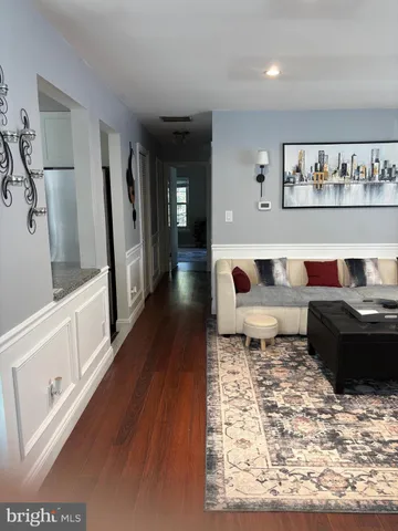 a living room with furniture and a rug