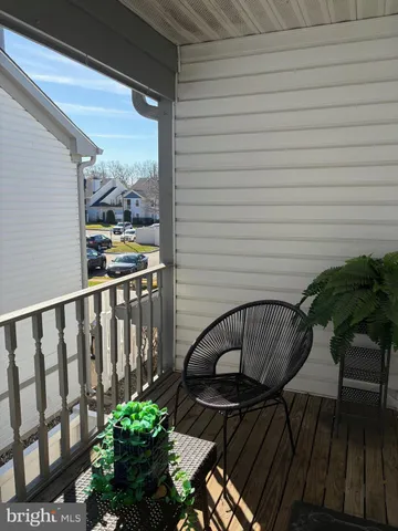 a view of balcony with furniture