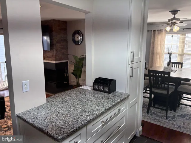 a kitchen with a table and chairs in it