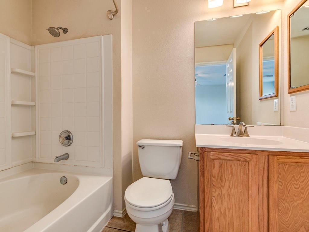 6 Verde Ranch Loop Leander, TX 78641 - Photo 15 of 24 Bathroom with shower / bath combination, vanity, and tile patterned floors