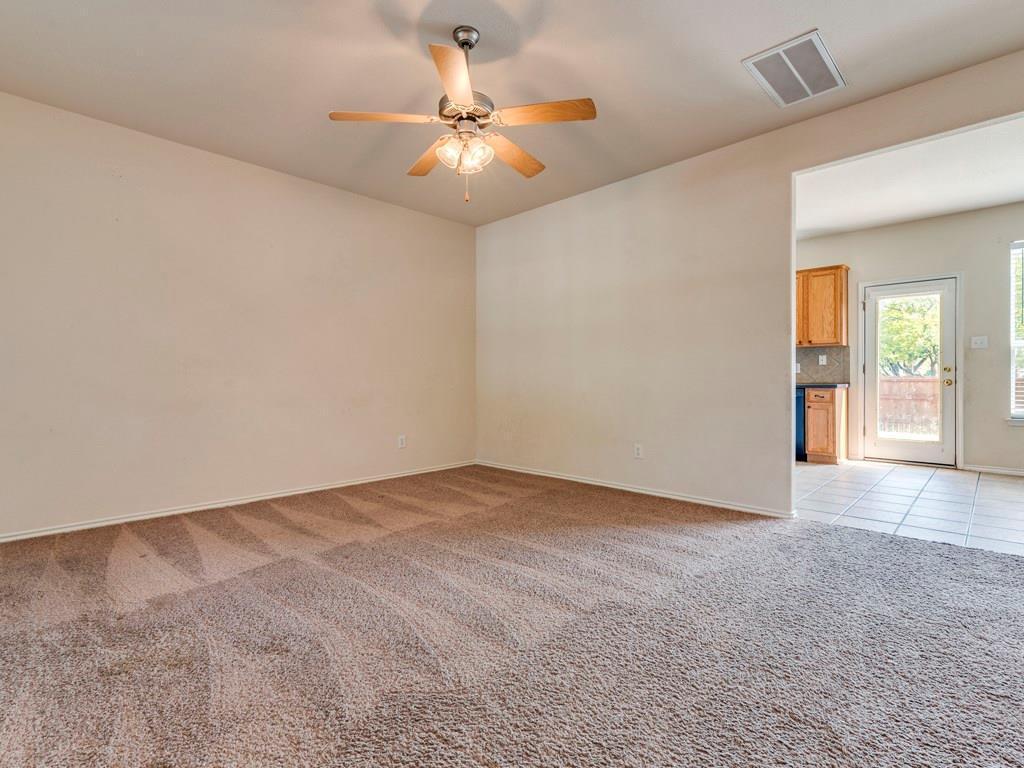 6 Verde Ranch Loop Leander, TX 78641 - Photo 5 of 24 Spare room featuring light carpet and ceiling fan