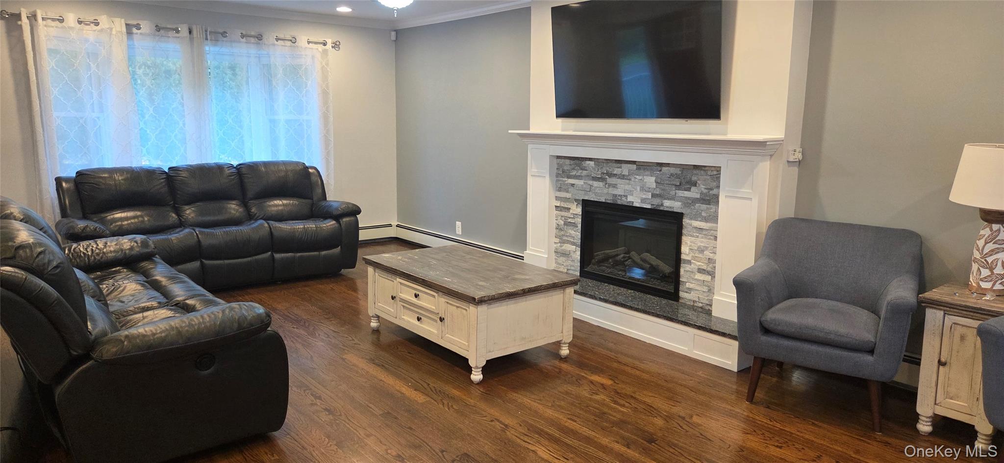522 Moriches Road St. James, NY 11780 - Photo 10 of 49 a living room with furniture and a fireplace