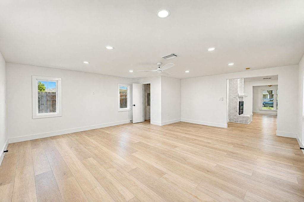 1904 Apollo Road Richardson, TX 75081 - Photo 16 of 40 Recessed lighting illuminates the expansive interior featuring wood-finish flooring and a white ceiling fan