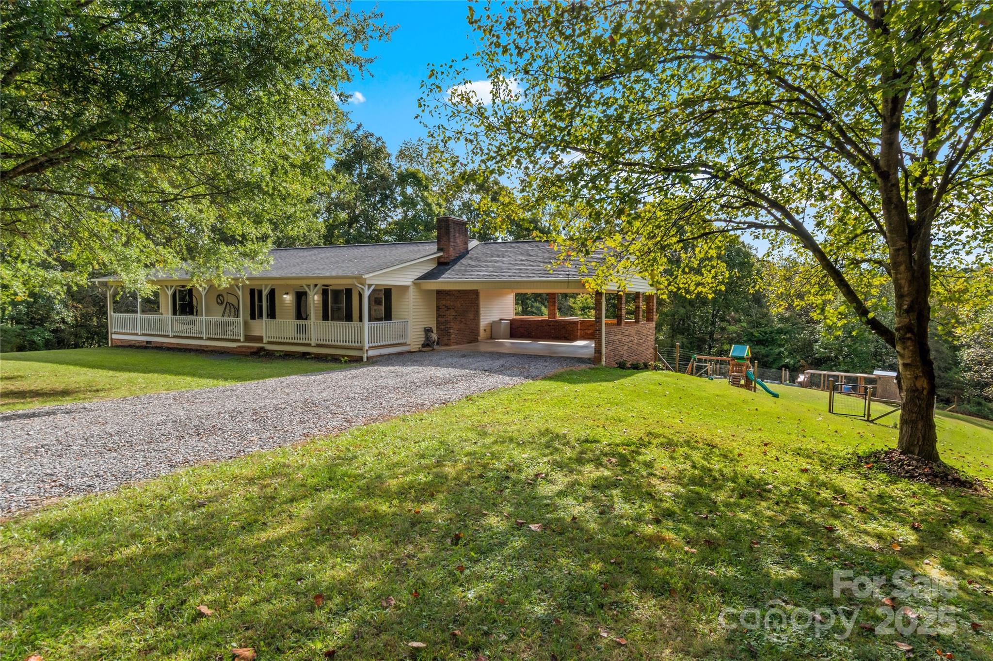 1627 Stony Knoll Road Dobson, NC 27017 - Photo 1 of 43 a view of a house with a backyard