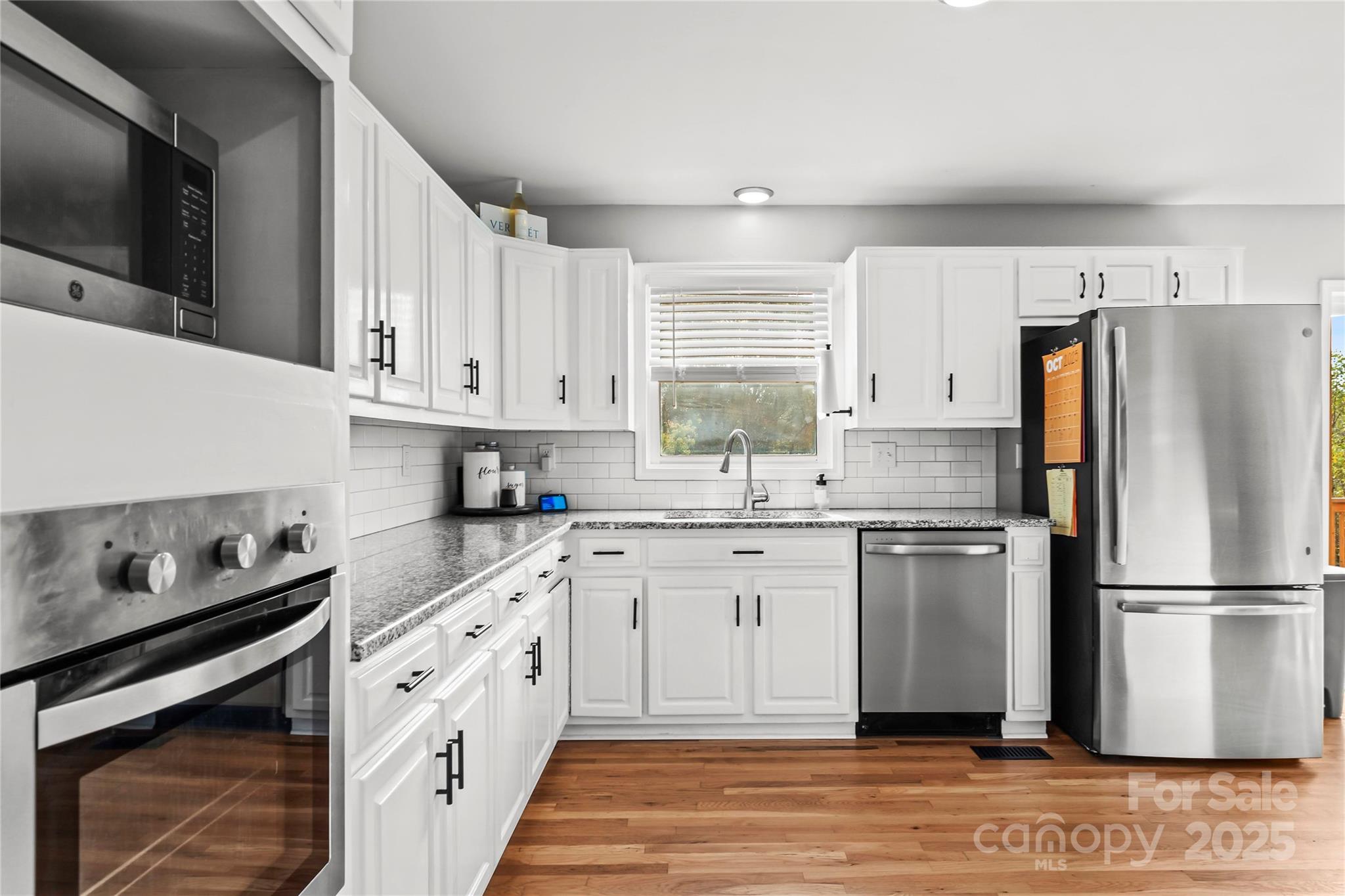 1627 Stony Knoll Road Dobson, NC 27017 - Photo 14 of 43 a kitchen with a refrigerator stove and sink