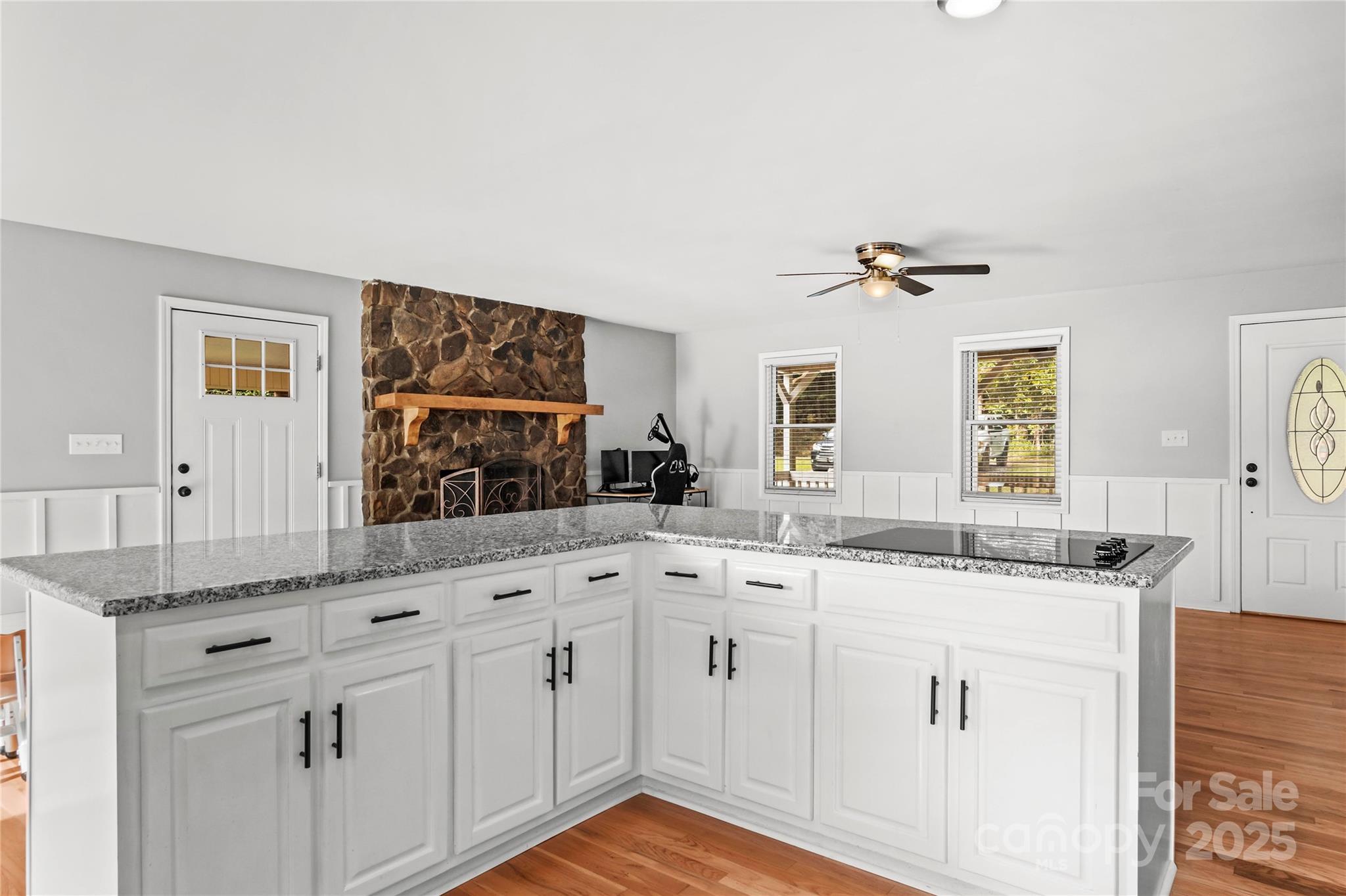 1627 Stony Knoll Road Dobson, NC 27017 - Photo 15 of 43 a kitchen with white cabinets and a sink