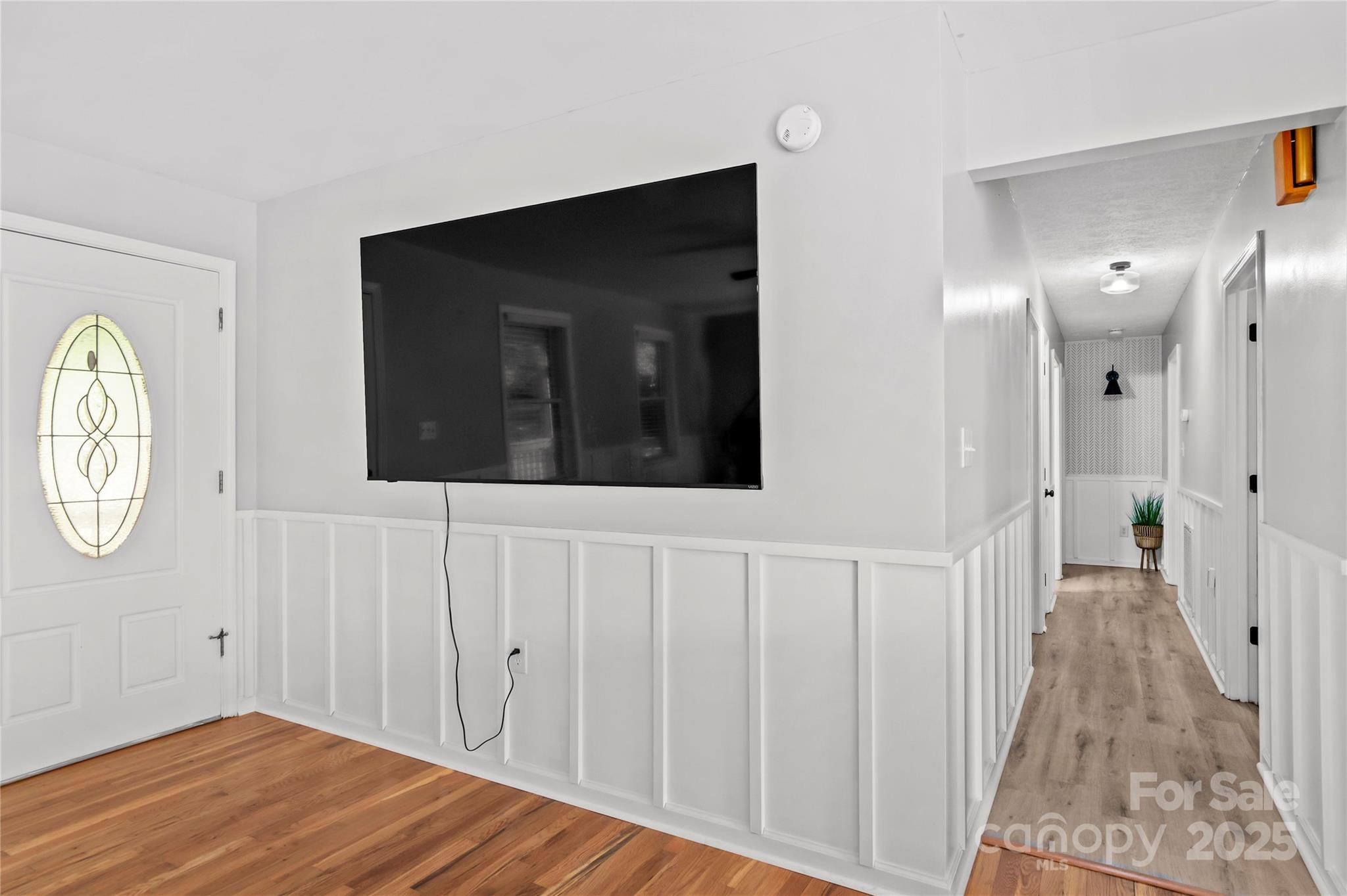 1627 Stony Knoll Road Dobson, NC 27017 - Photo 16 of 43 a view of a hallway with wooden floor