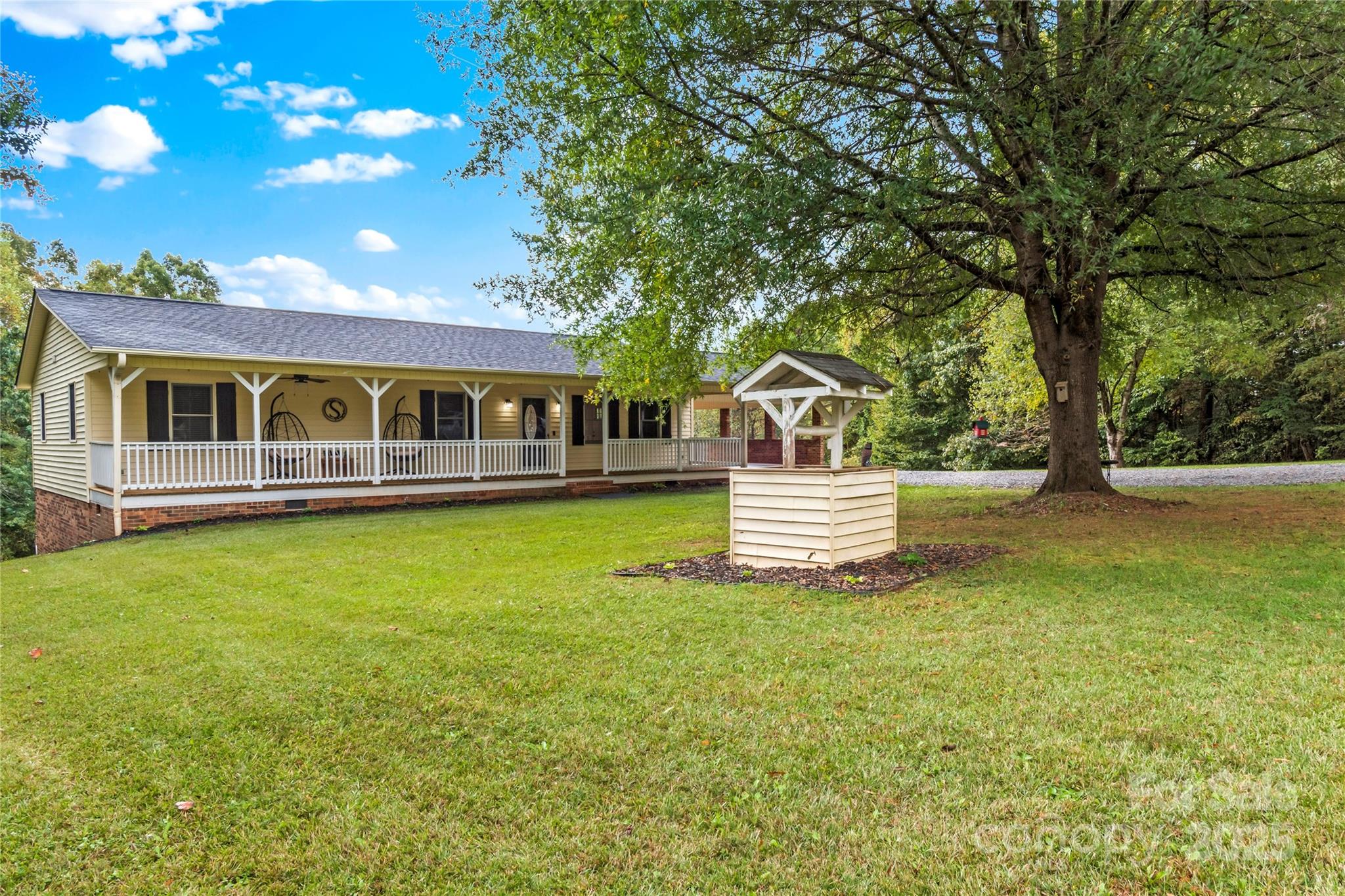 1627 Stony Knoll Road Dobson, NC 27017 - Photo 2 of 43 a view of a house with a backyard porch and sitting area