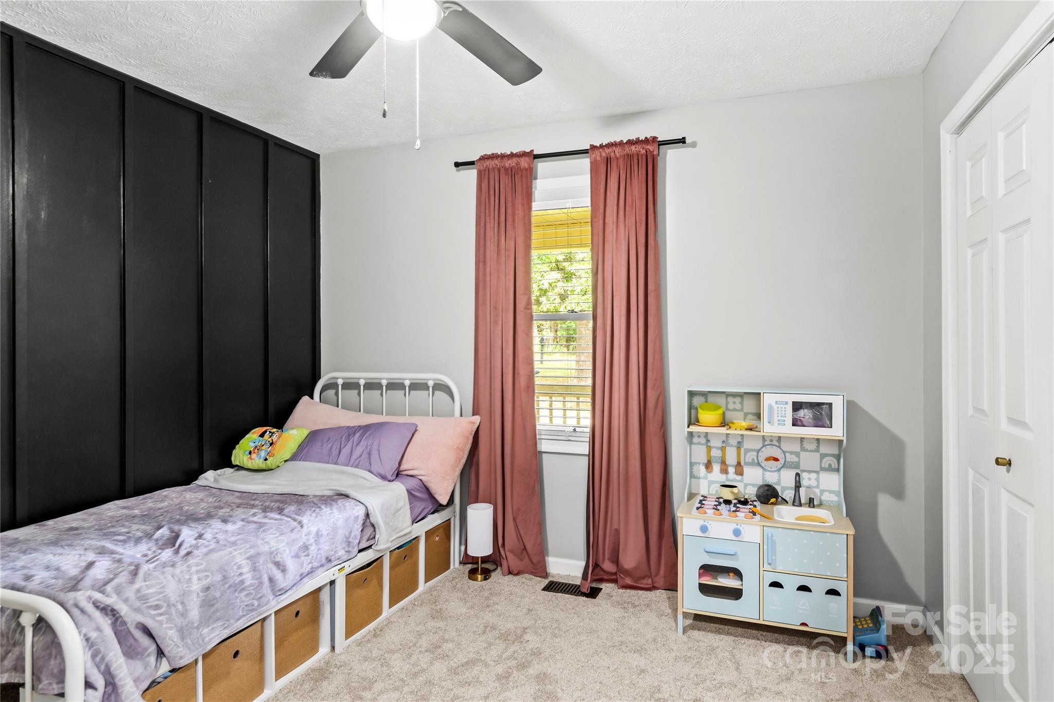 1627 Stony Knoll Road Dobson, NC 27017 - Photo 24 of 43 a bedroom with a bed and a window