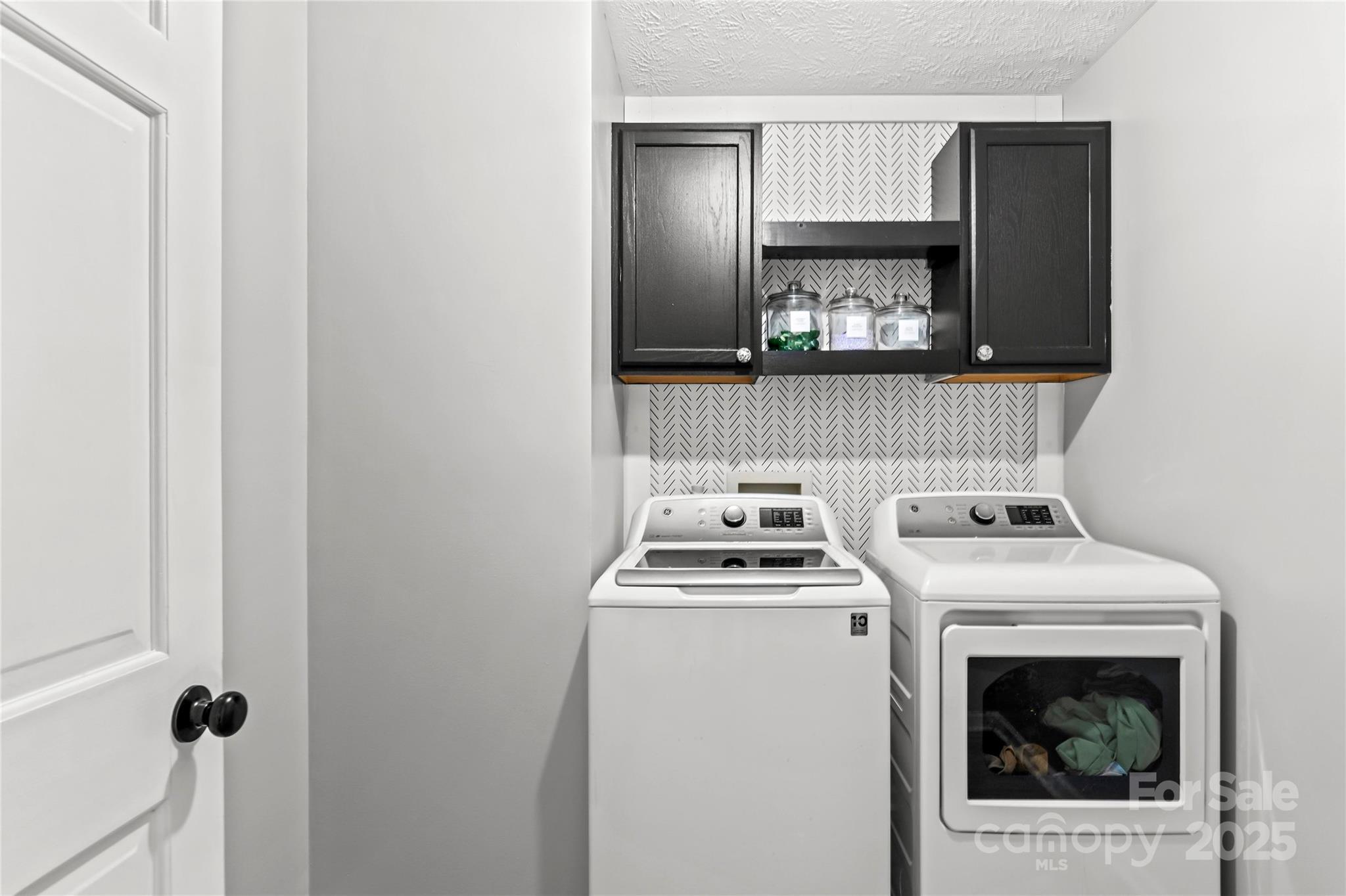 1627 Stony Knoll Road Dobson, NC 27017 - Photo 26 of 43 a utility room with dryer and washer