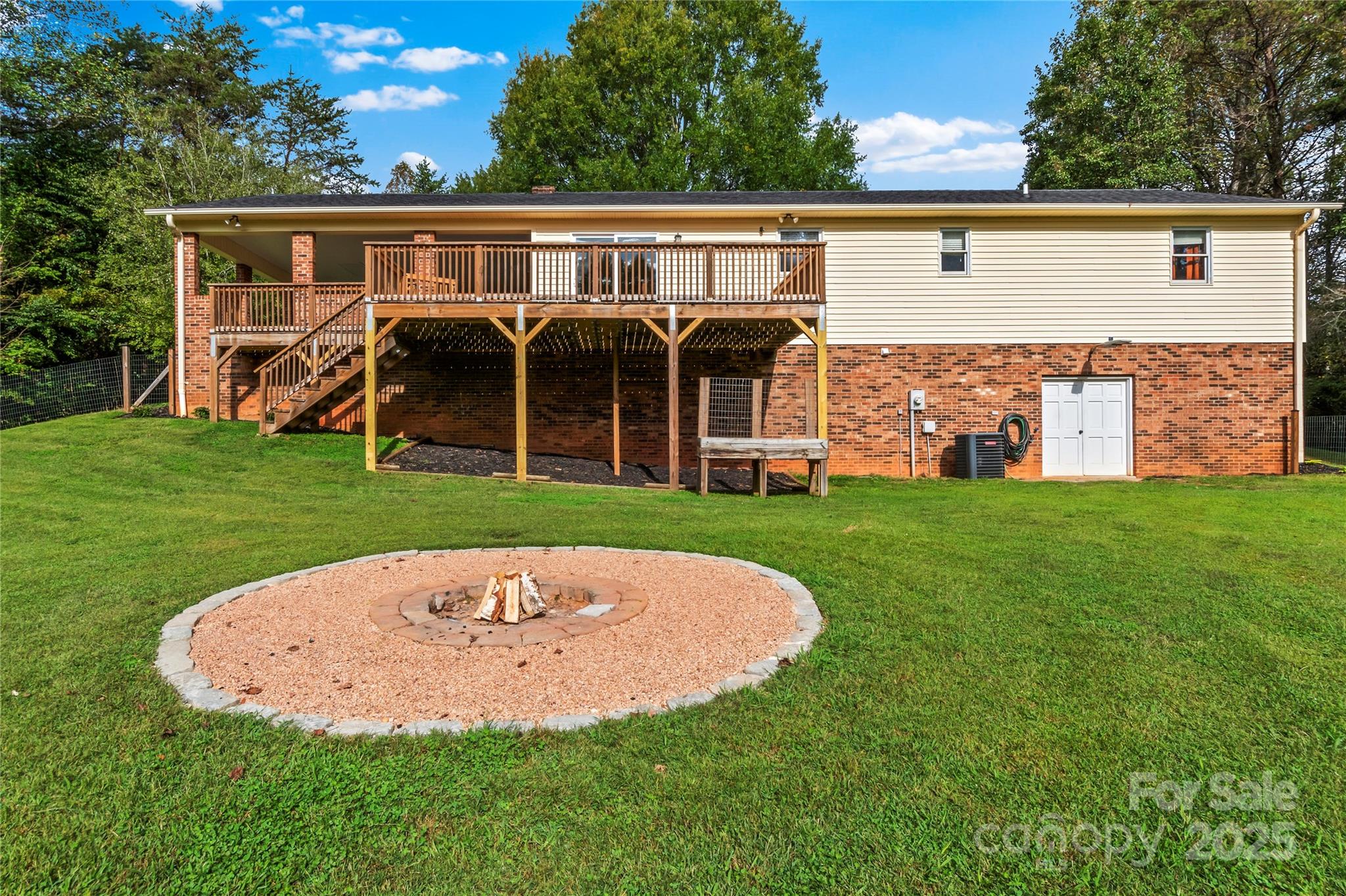 1627 Stony Knoll Road Dobson, NC 27017 - Photo 29 of 43 a view of a house with a backyard