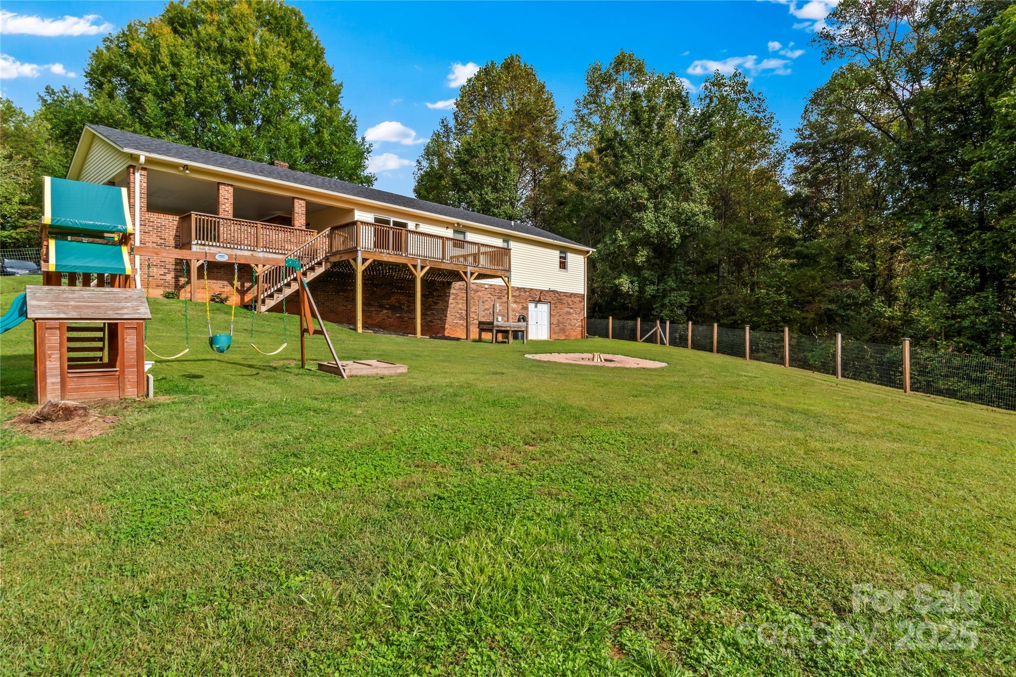 1627 Stony Knoll Road Dobson, NC 27017 - Photo 30 of 43 a view of a house with a yard