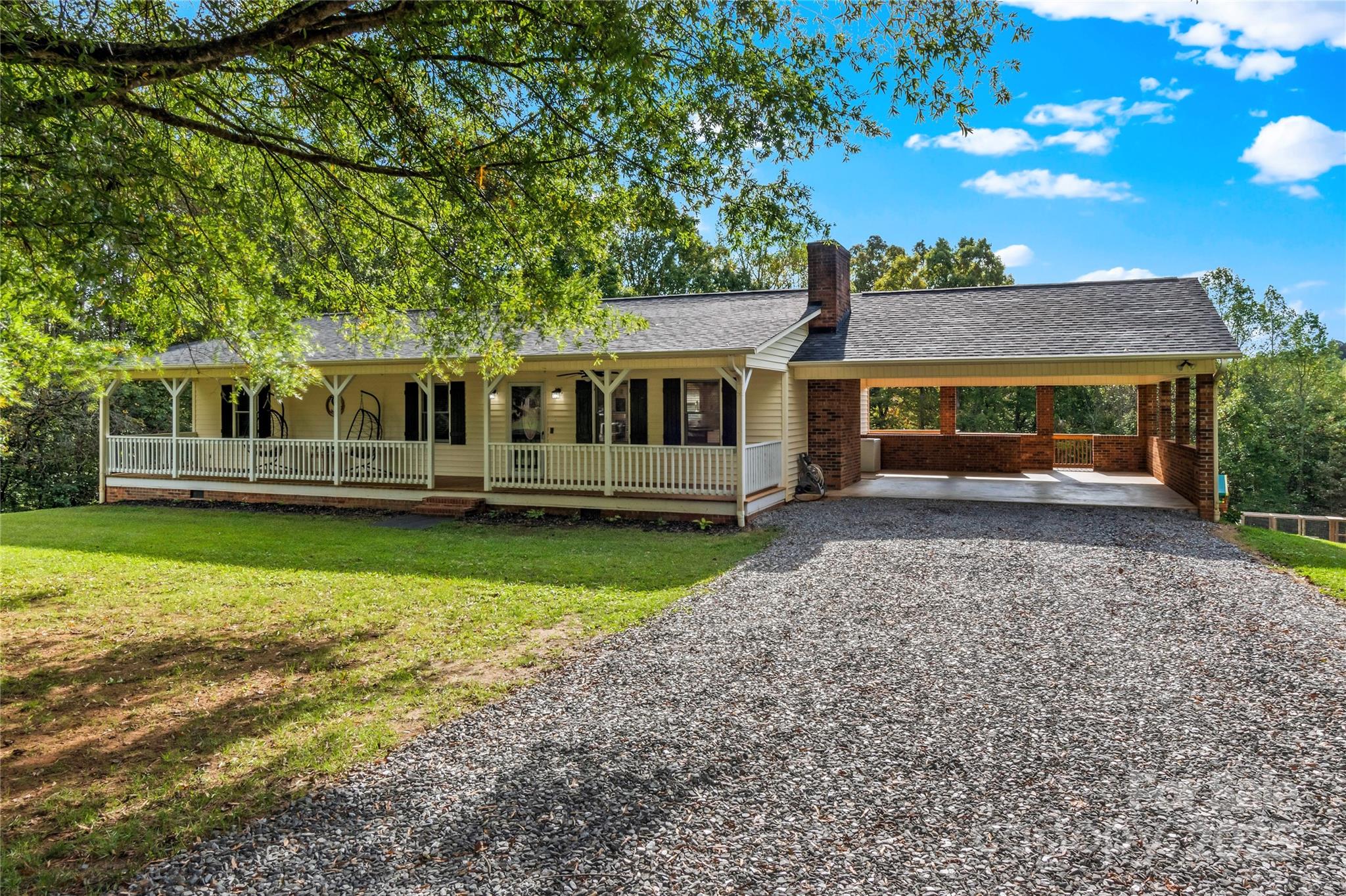 1627 Stony Knoll Road Dobson, NC 27017 - Photo 3 of 43 front view of house with a yard