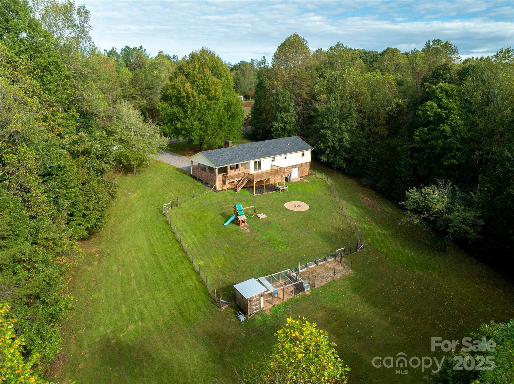 1627 Stony Knoll Road Dobson, NC 27017 - Photo 38 of 43 a view of a golf course with a lake