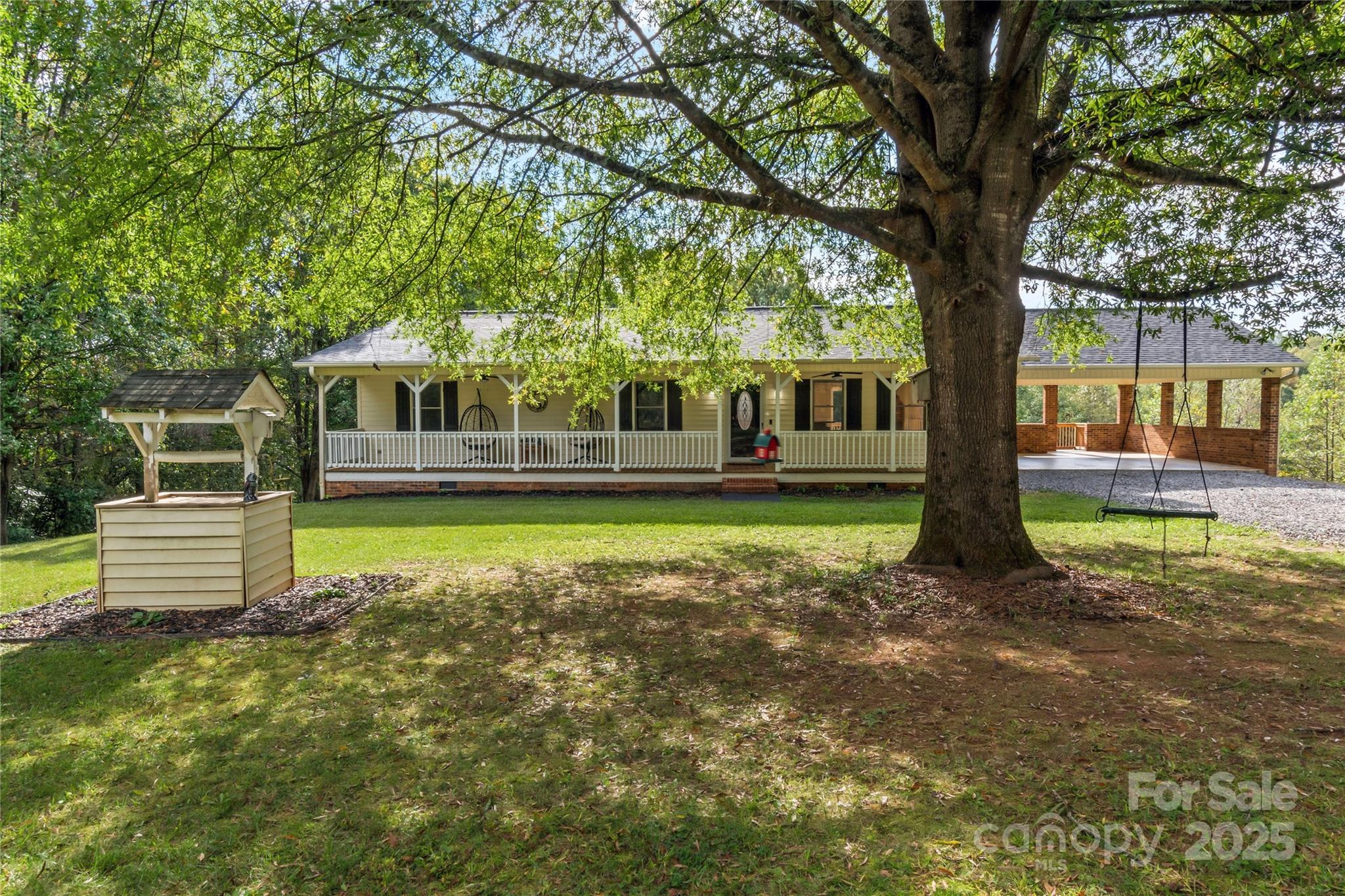 1627 Stony Knoll Road Dobson, NC 27017 - Photo 4 of 43 a view of a house with a backyard