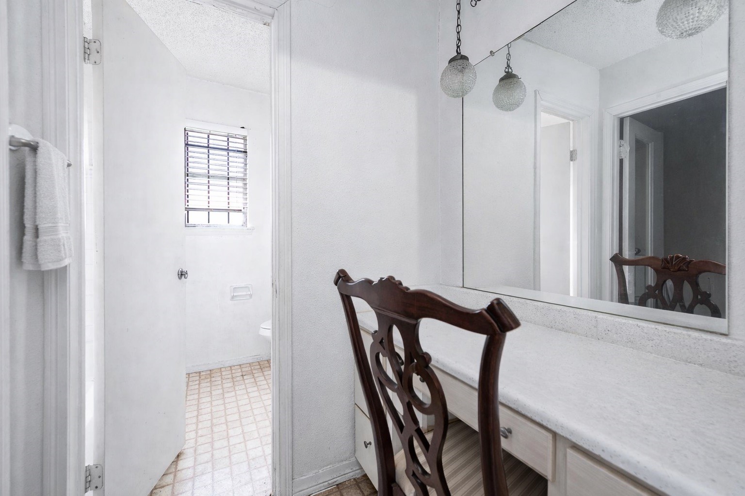 12703 Redfern Drive Houston, TX 77048 - Photo 11 of 15 a view of a hallway with furniture and a window