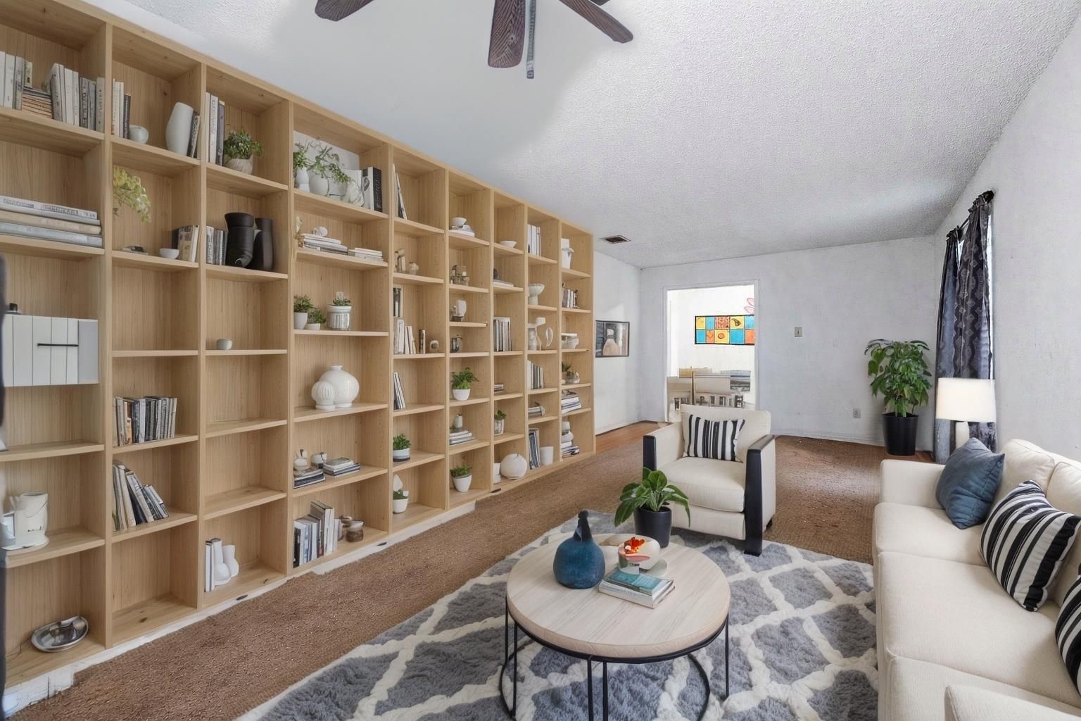 12703 Redfern Drive Houston, TX 77048 - Photo 12 of 15 a view of a livingroom with furniture and a book shelf