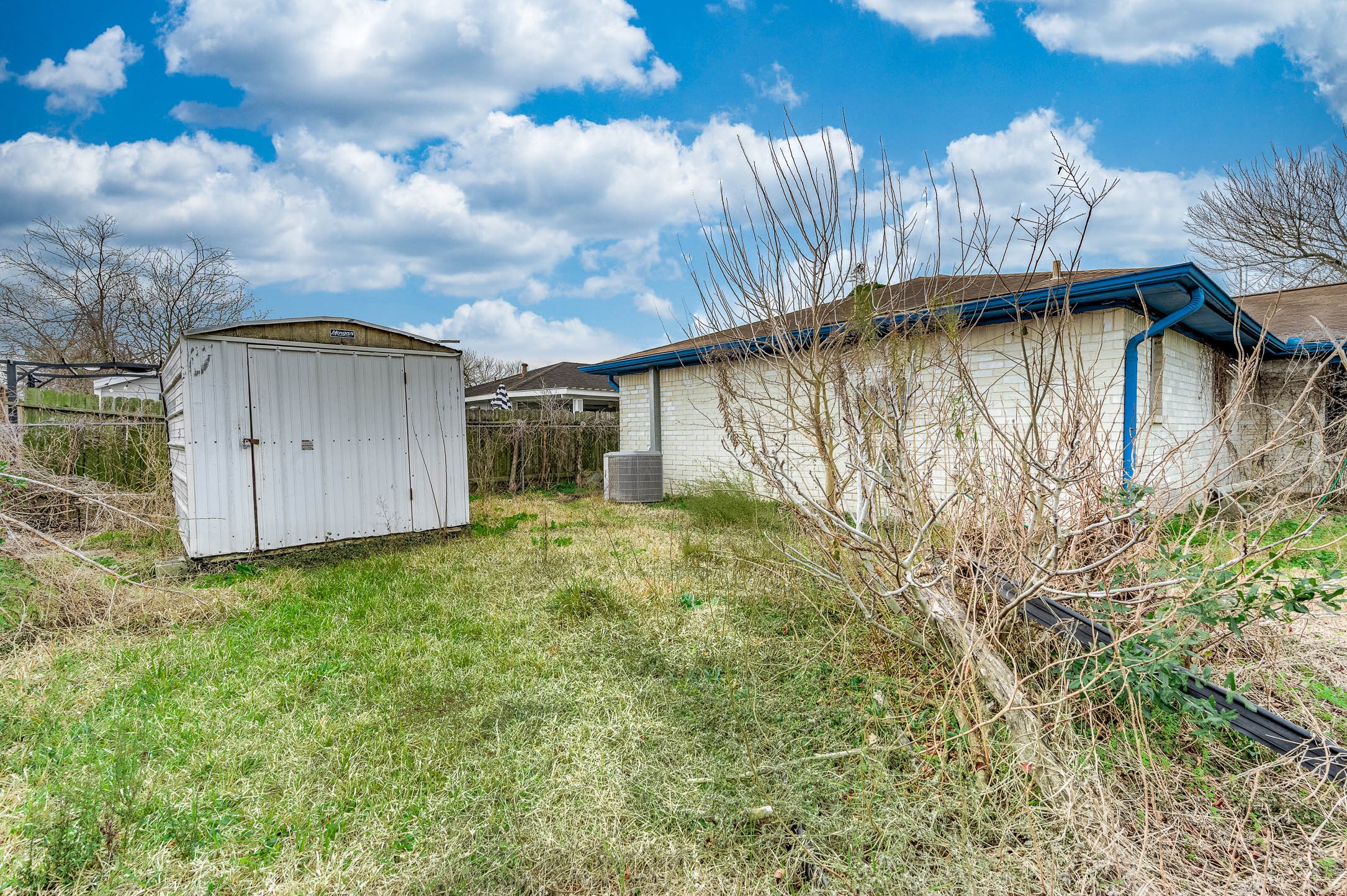 12703 Redfern Drive Houston, TX 77048 - Photo 14 of 15 a view of a house with a yard