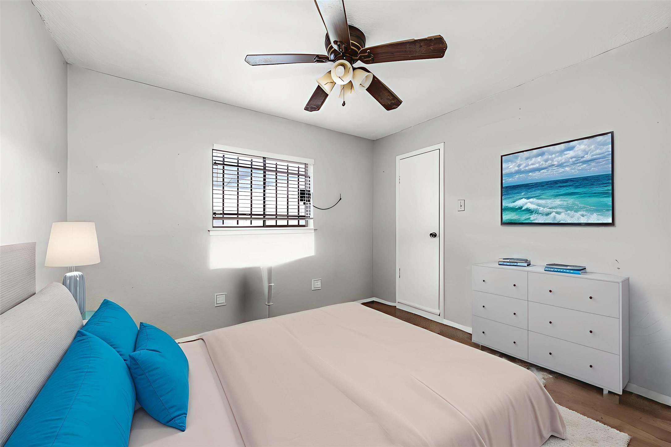 12703 Redfern Drive Houston, TX 77048 - Photo 8 of 15 a bedroom with a bed and a chandelier